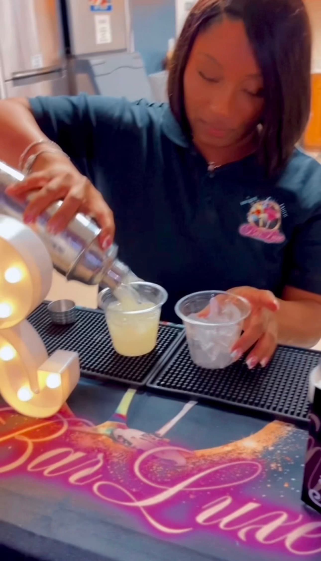 BigCee Exotic BarLuxe bartender crafting a signature cocktail